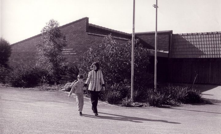 Vern Barnett School with child infront resized